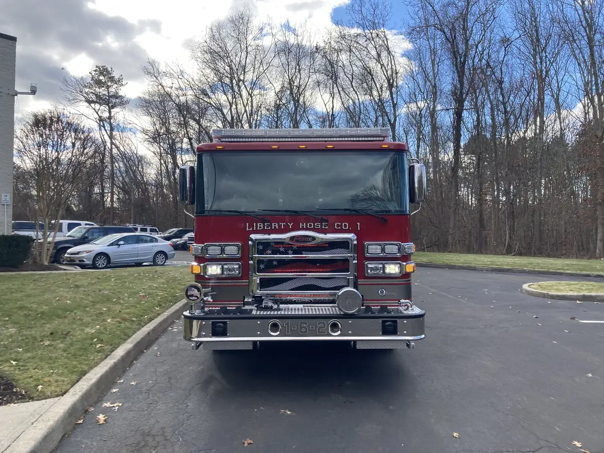 Front-right exterior view showing grille, bumper, and cab side profile