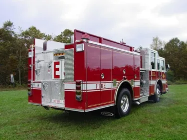 Rear-right exterior view showing rear body panel and side compartment doors