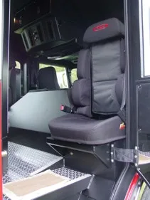 Cab interior view showing seat, step entry, and rear crew area