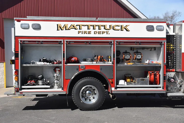 Side profile with open compartments showing lower shelf and wheel area