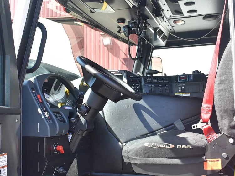 Driver cockpit view showing steering wheel, dashboard, and center console
