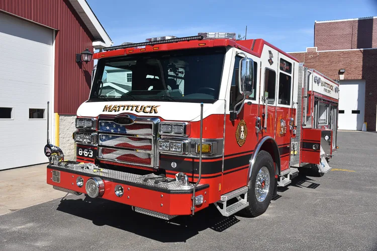 Front-left exterior close view showing grille, bumper, and cab