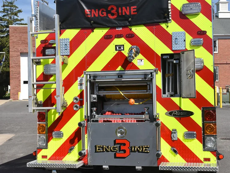 Rear compartment close-up showing open center bay on chevron panel