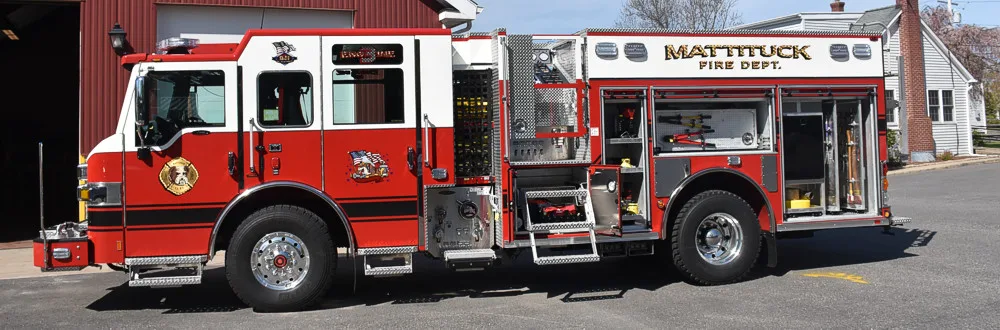 Pumper driver-side profile view showing full body and closed compartments