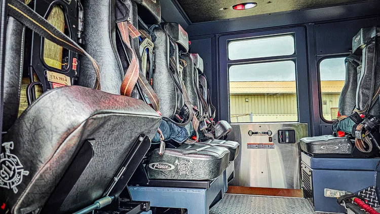Rear crew interior view showing seat row and center aisle