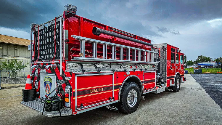 Rear-left profile showing side body and rear ladder rack section