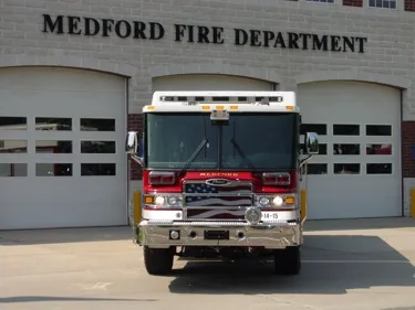 Head-on front view showing the grille, windshield, warning lights, and front bumper fittings.