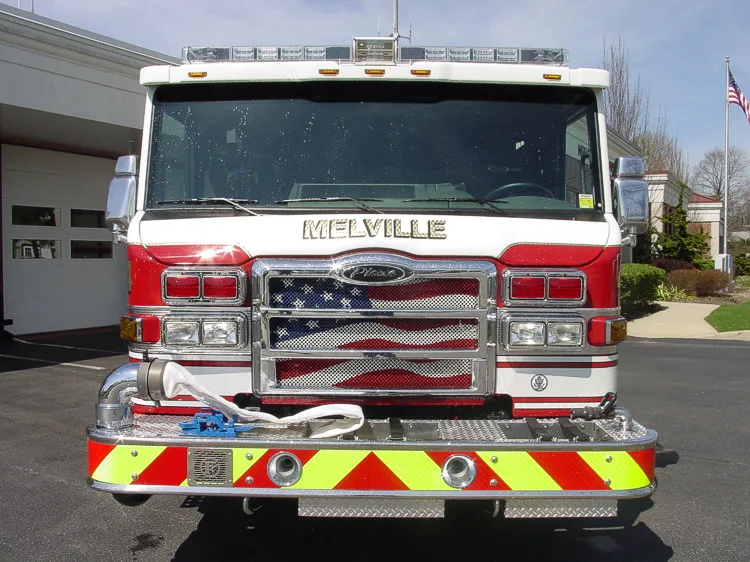 Front exterior view showing grille, bumper, and warning lights