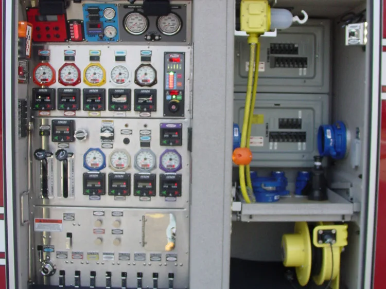 Pump panel close-up showing gauges, valves, and mounted tools