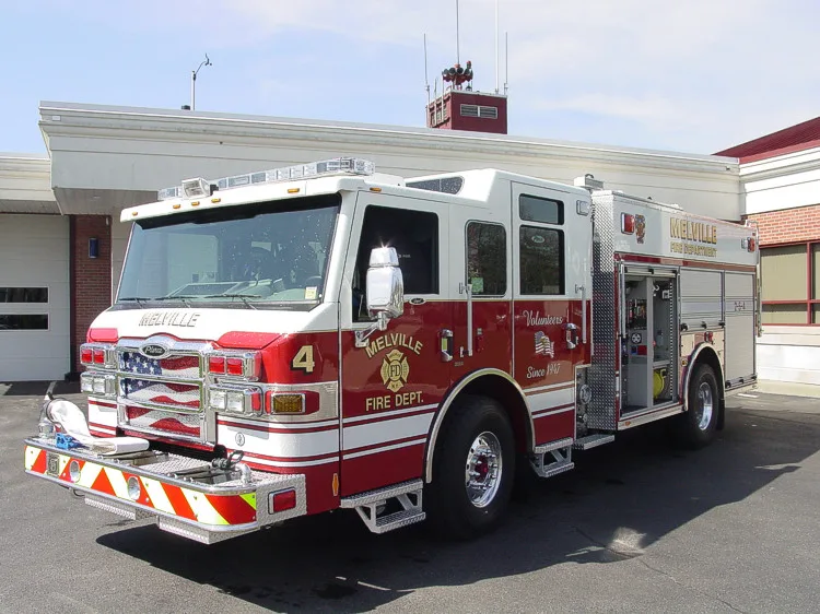 Front-left exterior view showing enclosed cab and side body