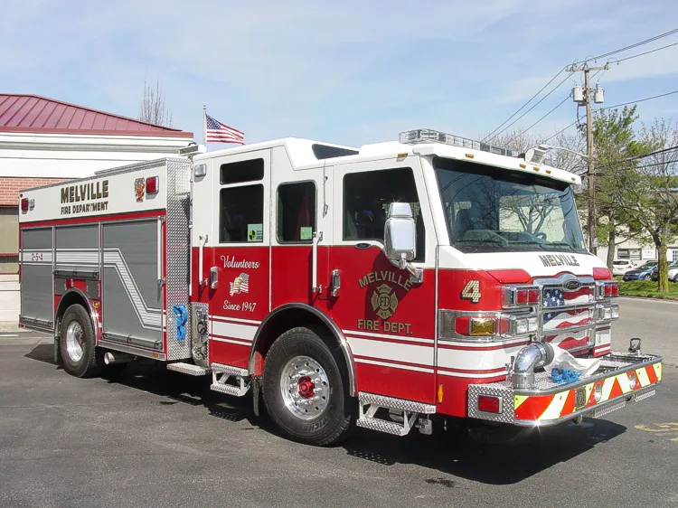 Front-left three-quarter view showing cab and side compartments