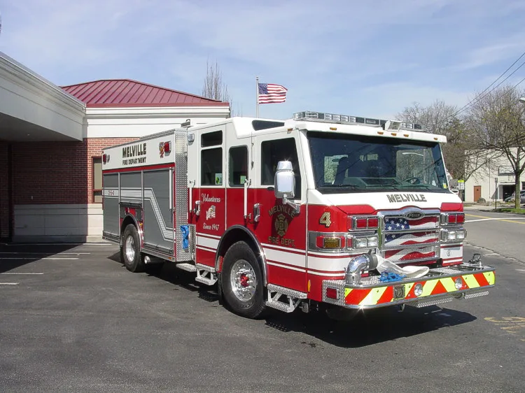 Front-left exterior view showing bumper, cab, and side body