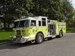 Wide front-left thumbnail view of the lime pumper parked roadside.