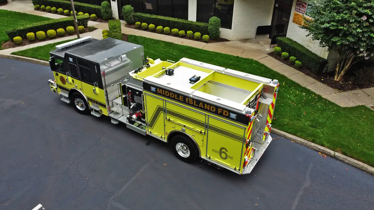 Aerial top-down side view showing full apparatus profile and compartment spacing