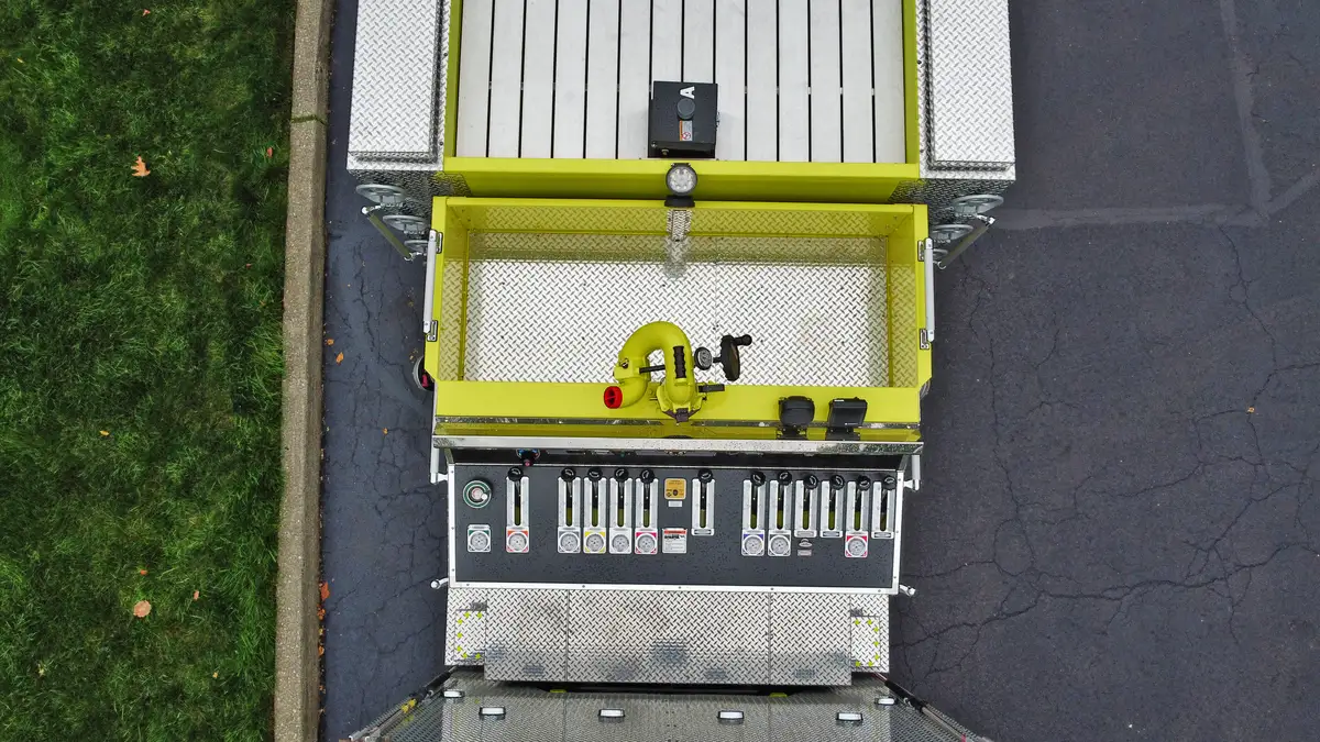 Aerial top-down rear-right view showing hosebed area and rear chevrons