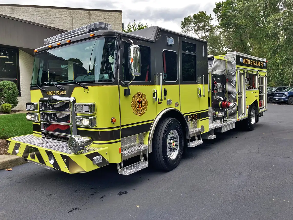 Driver-side profile view showing pump-panel side and compartment doors