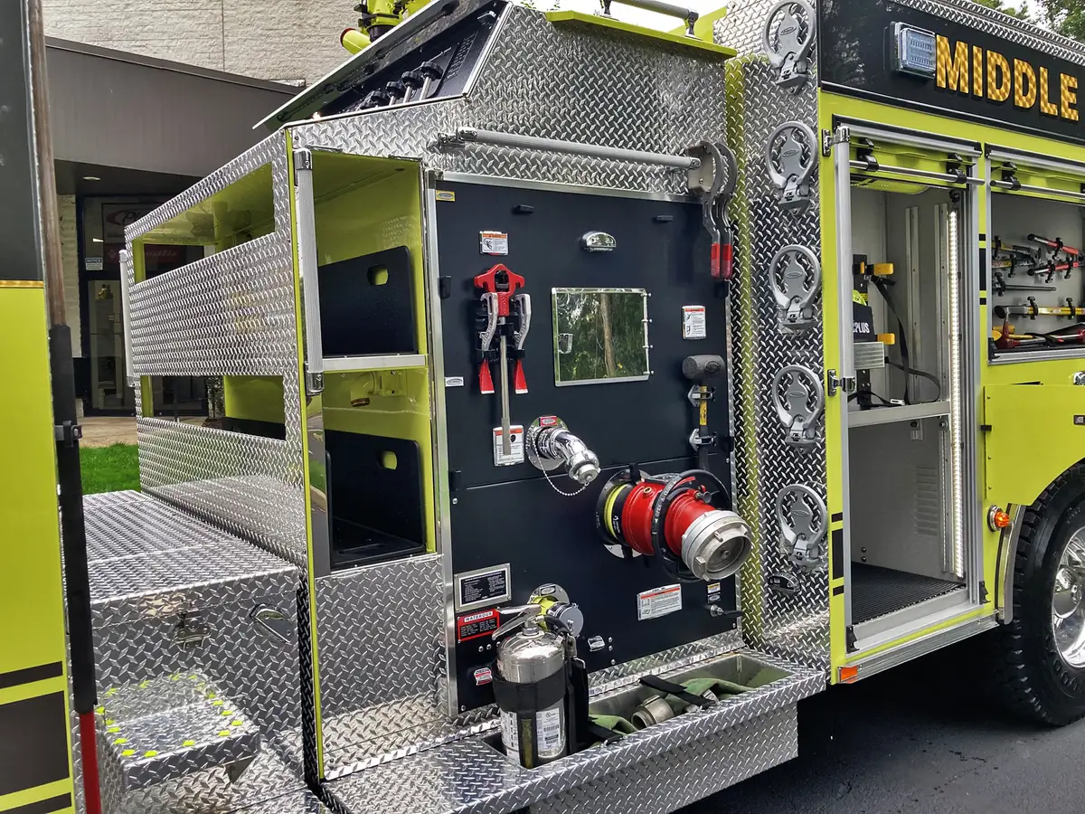 Officer-side profile view showing body compartments and rear wheel area