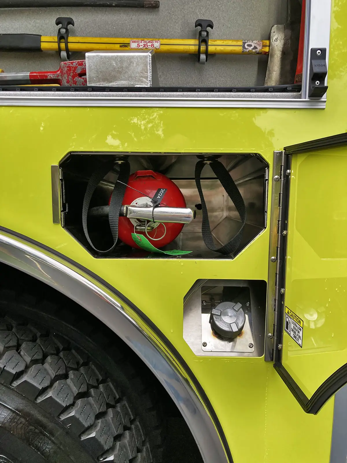 Pump panel close-up showing gauges, valve handles, and intake controls