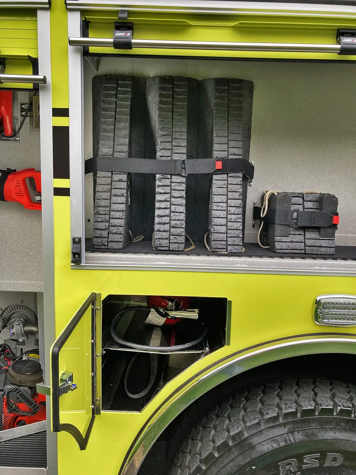 Open rear body compartment showing shelf stack and center storage bay