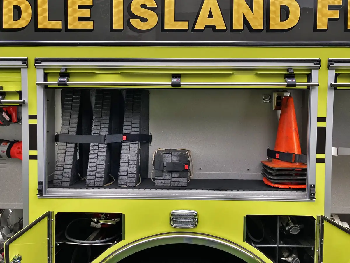 Hosebed close-up showing stacked hose loads above rear chevrons