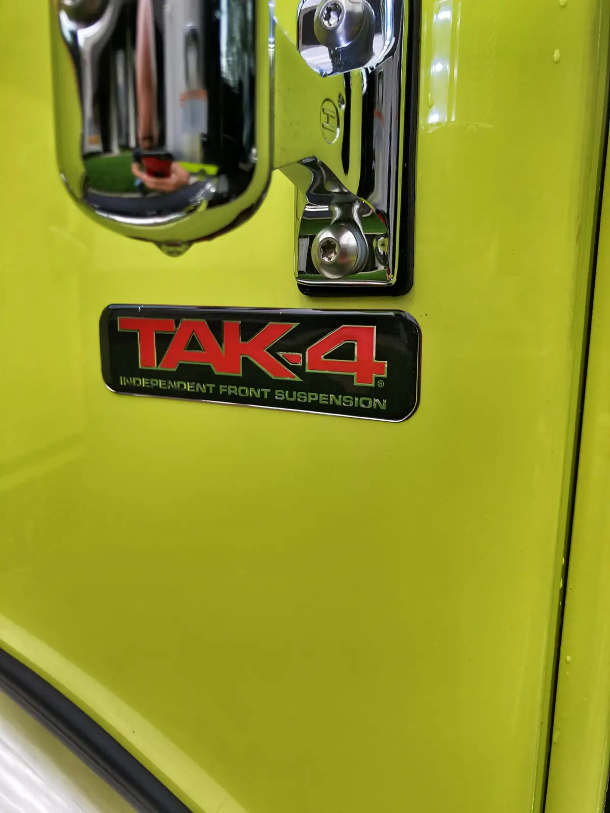 Center console close-up showing radios, toggle switches, and charging mounts