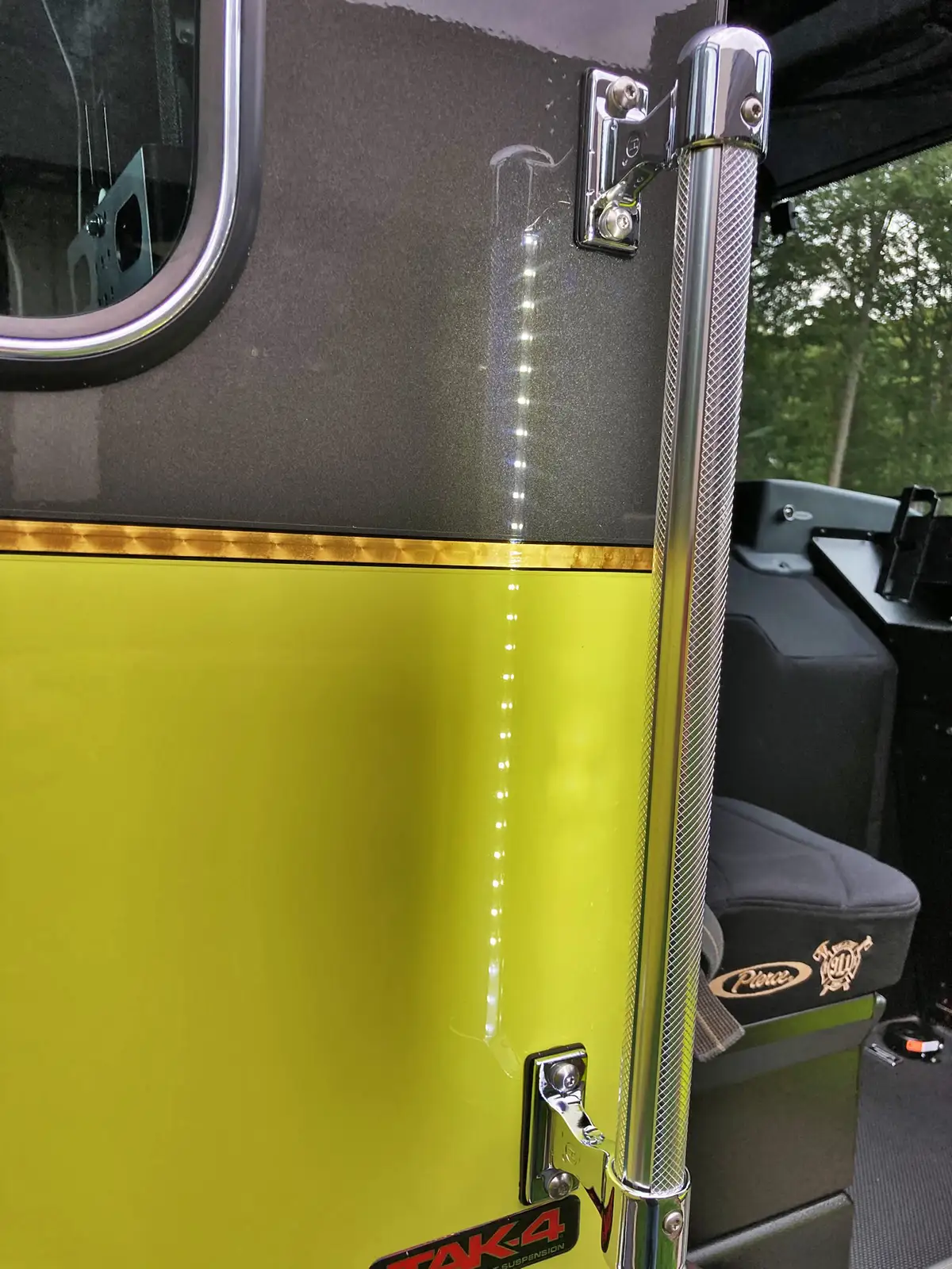 Rear crew compartment view showing SCBA seats and center aisle