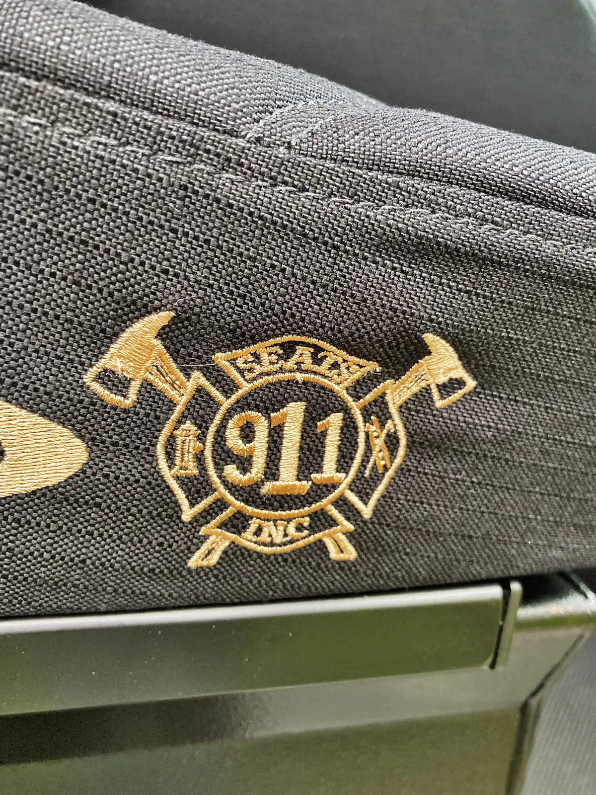 Rear crew seat close-up showing SCBA brackets and restraint straps