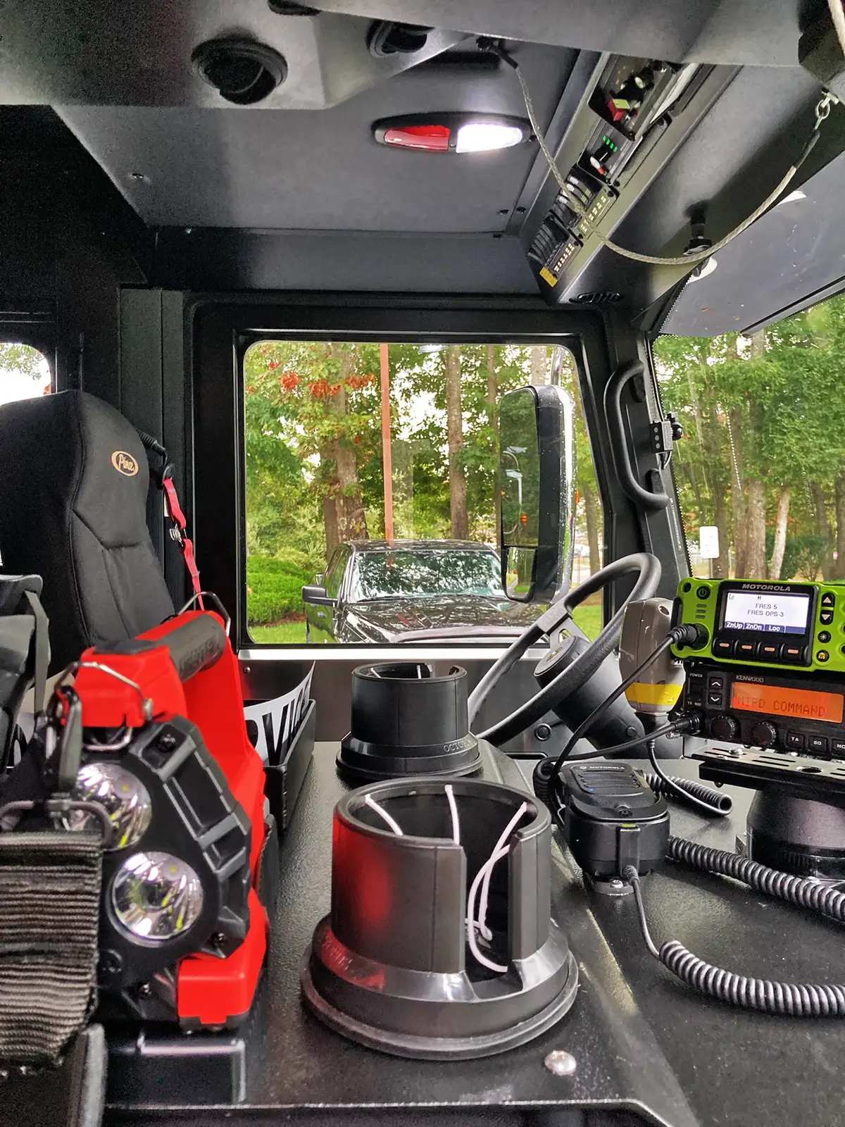 Cab overhead controls close-up showing switches and panel labels