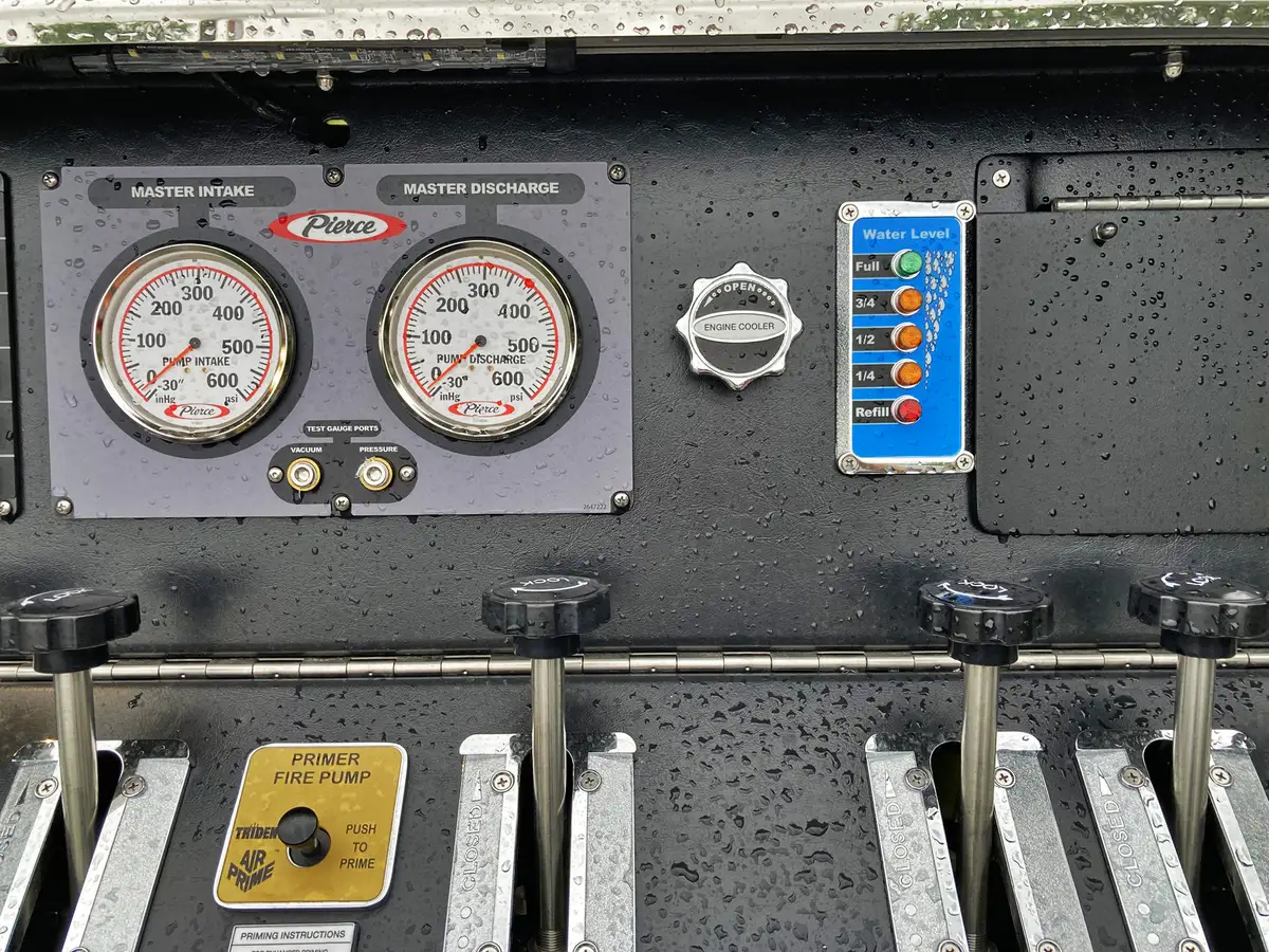 Rear-right exterior view showing chevrons, rear body corner, and wheel area