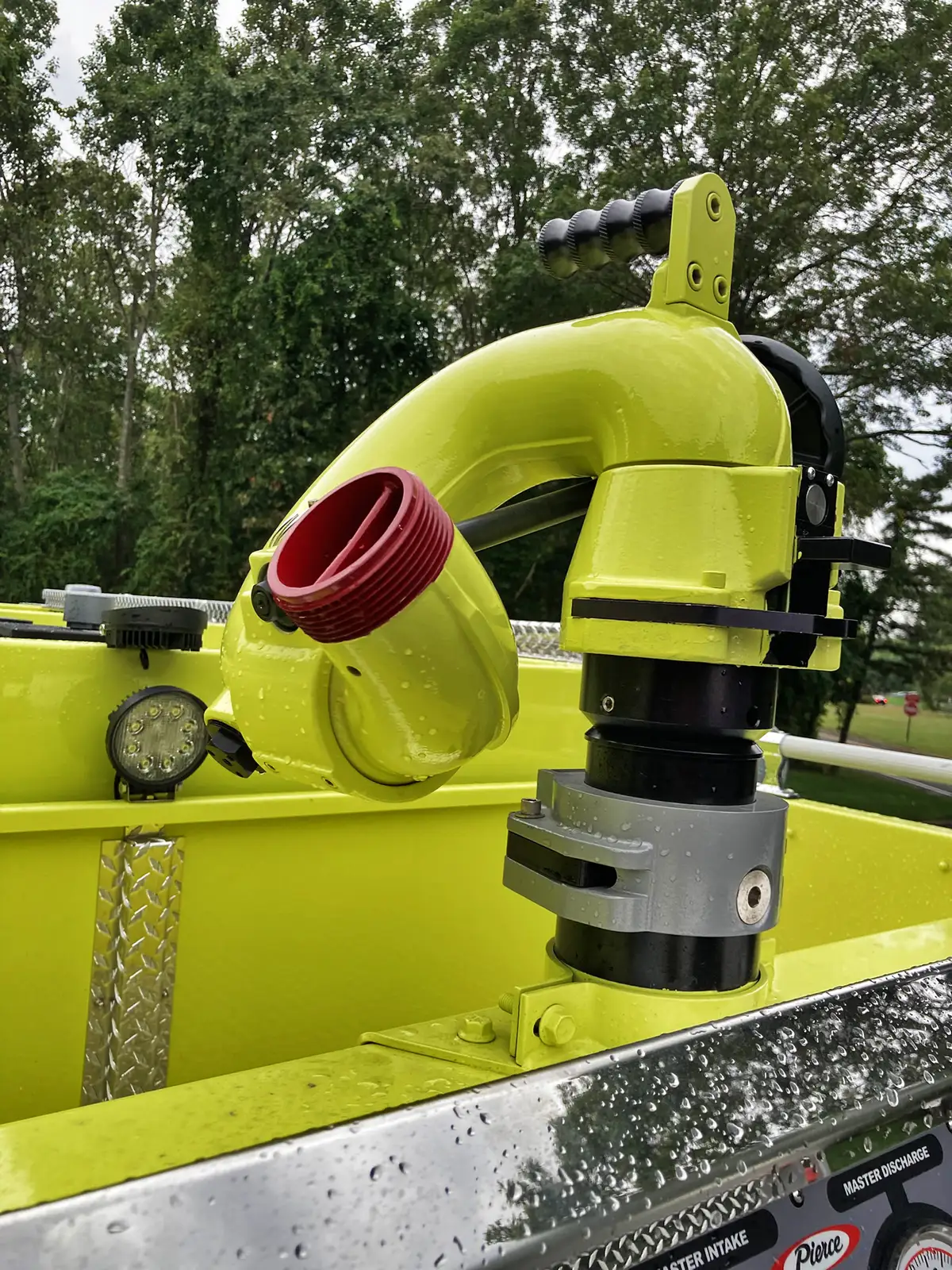 Driver-side profile view showing pump-panel section and rear compartments