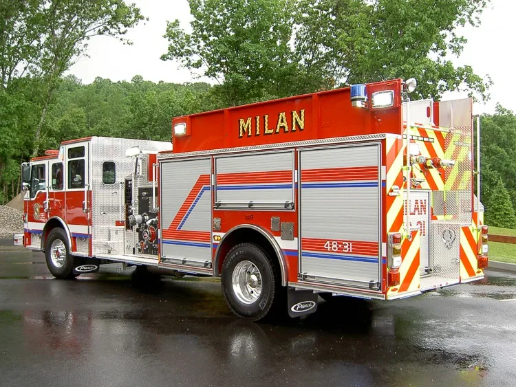 Rear-right exterior view showing chevrons, rear body, and side hosebed