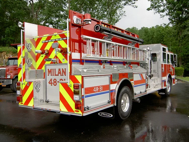 Rear-right exterior view showing side hosebed rails and rear wheel area