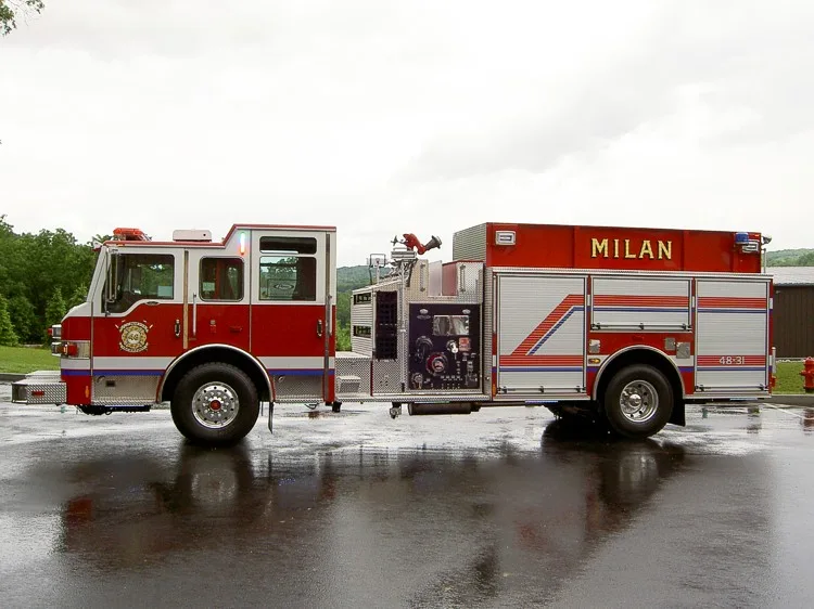 Driver-side profile view showing pump panel and side compartments