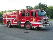 Wide front-right view of the tanker parked in the lot with full side body visible.