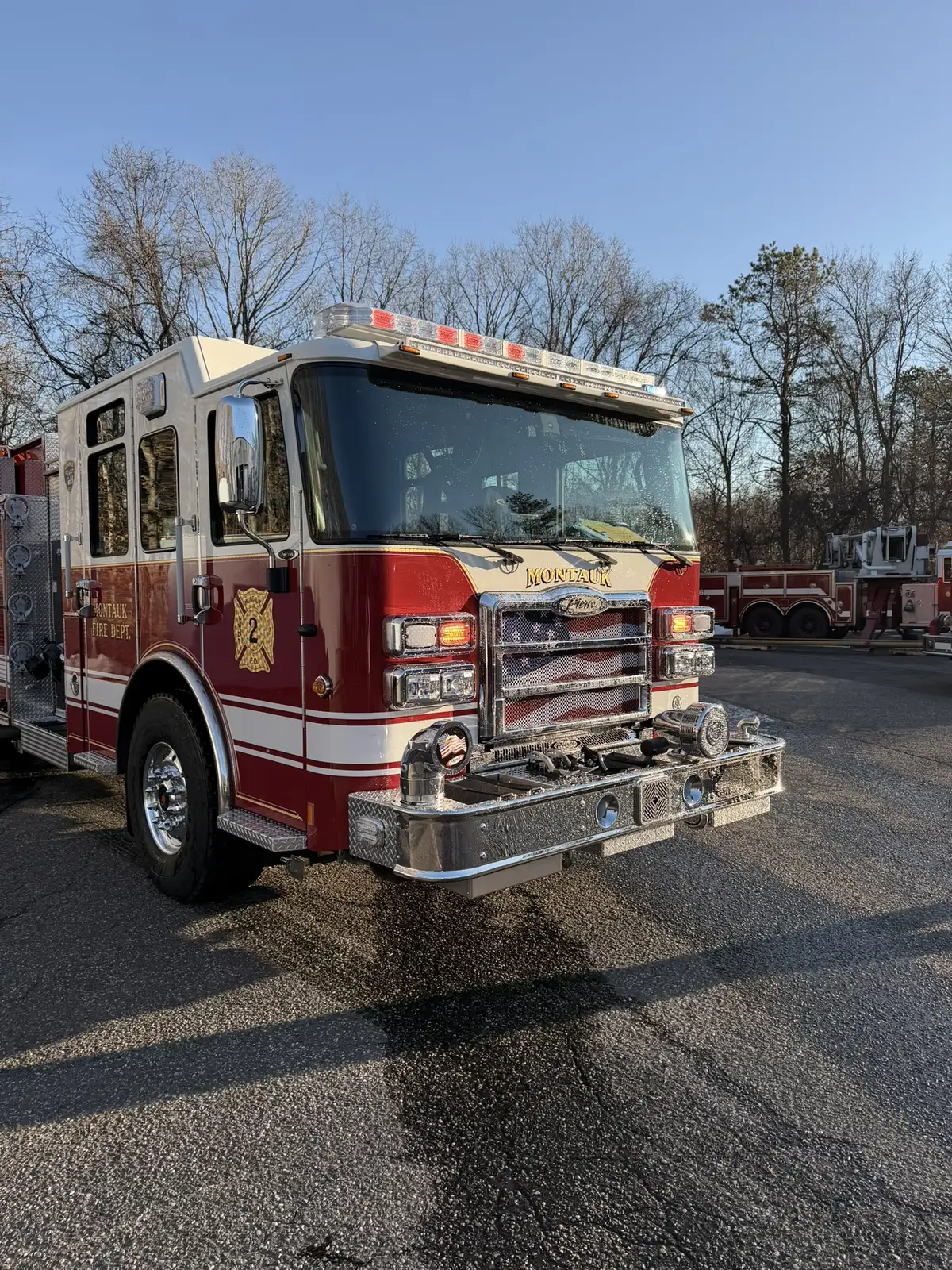 Head-on front view showing grille, bumper intakes, and warning lights