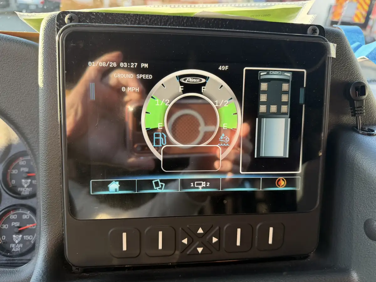 Center display close-up showing camera view and console buttons