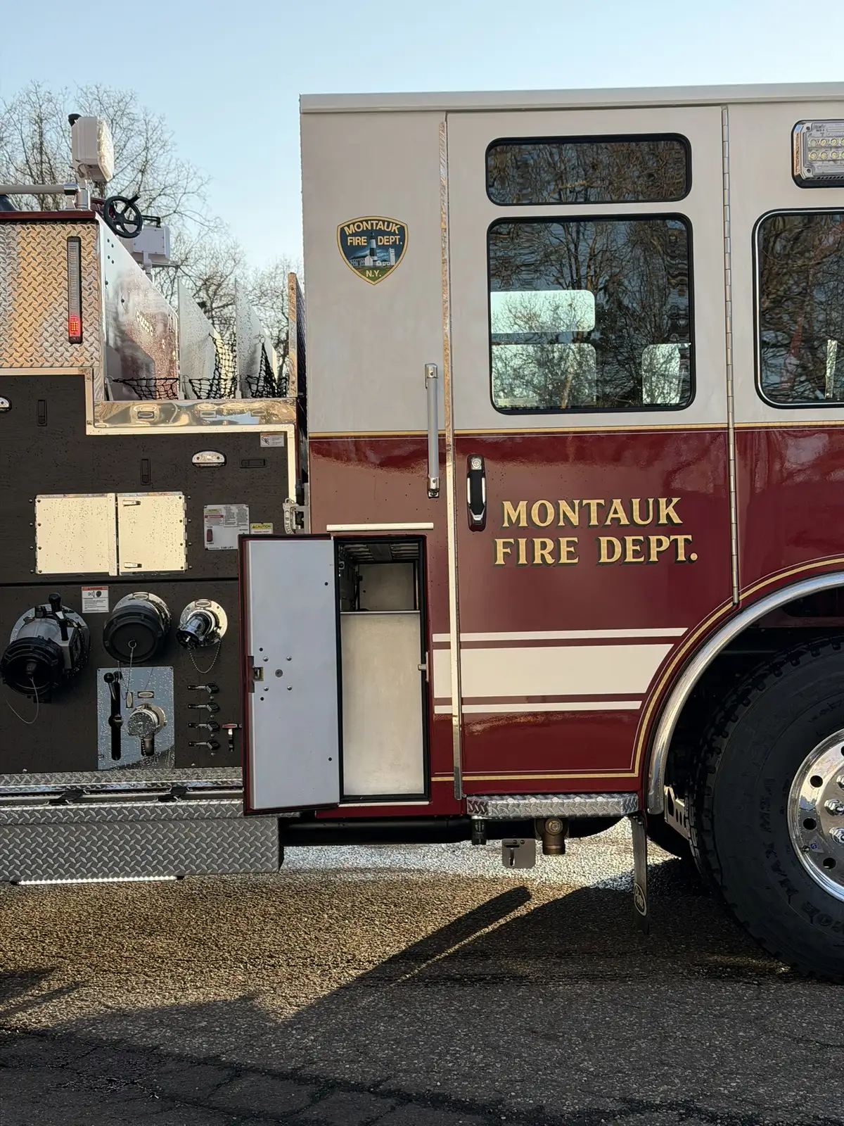 Driver-side mid-body view showing pump inlets and open narrow compartment