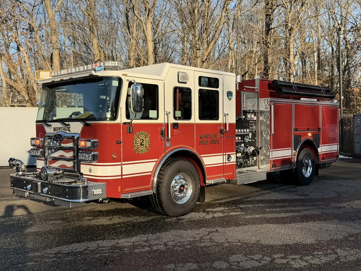 Front-left exterior view showing cab, side body, and front wheel