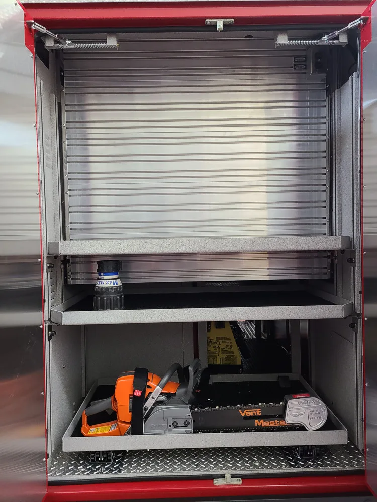 Open side compartment showing pull-out tray with tool storage