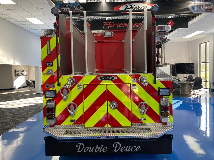 Rear view showing red-and-yellow chevrons and rear center panel