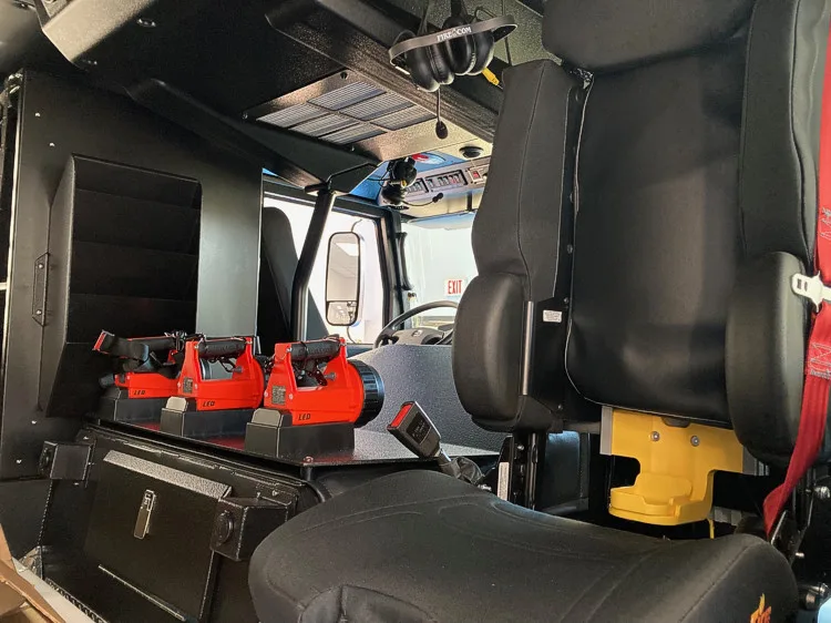 Cab interior side view showing rear seats and center aisle