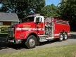 Small front-left exterior thumbnail of tanker truck on grass