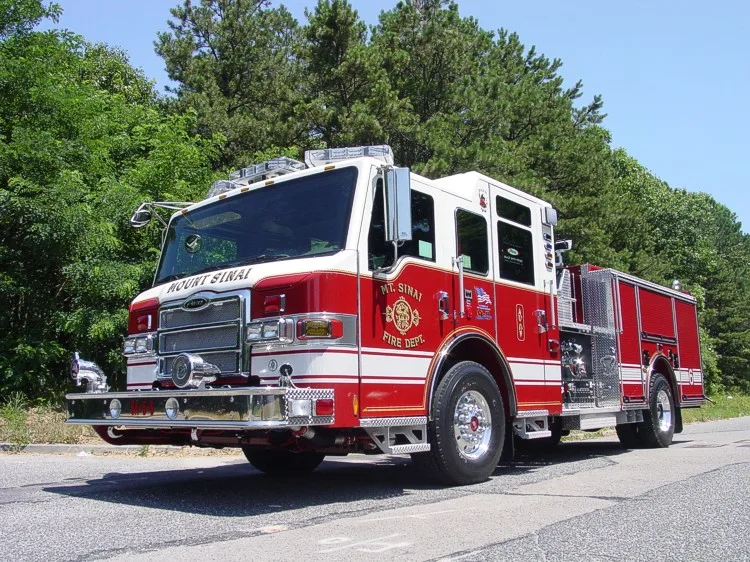 Front-right exterior view showing cab, bumper, and side body