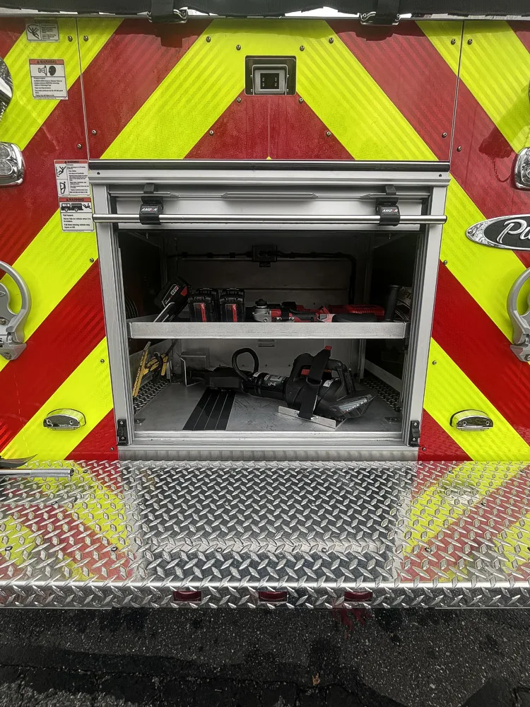 Rear chevron panel close-up with open center compartment and tray space