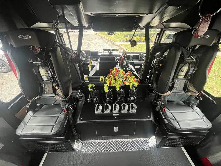 Rear crew interior view showing seat backs and SCBA restraint mounts