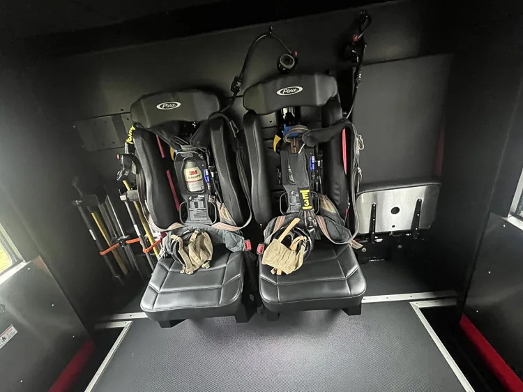 Rear crew interior close-up showing SCBA seats and center aisle