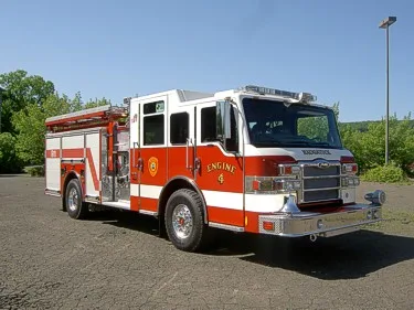 Front-right exterior view showing cab and side compartments