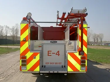 Rear view showing chevron striping and upper hosebed opening