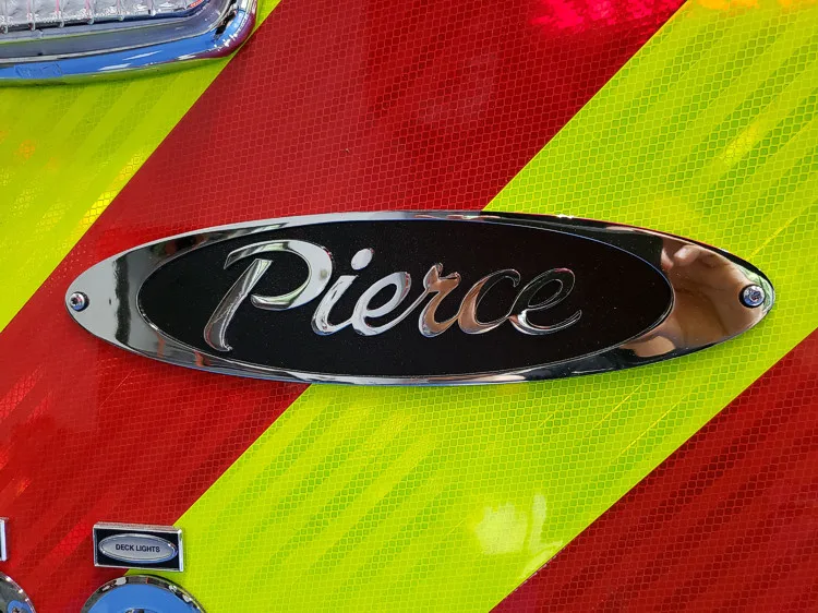 Body badge close-up showing Pierce emblem on chevron panel