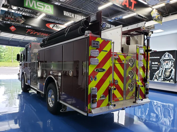 Rear-right exterior view showing side body and rear chevron panel